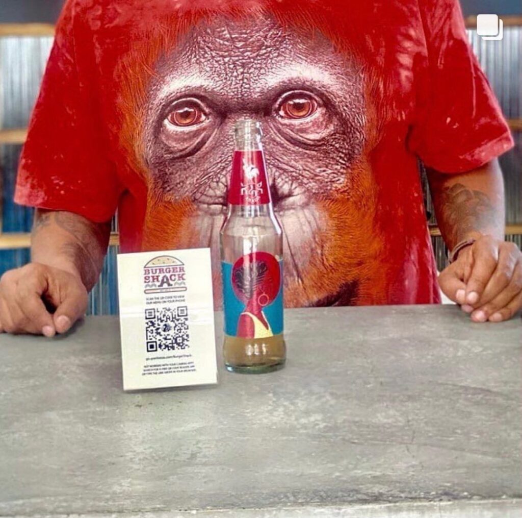 image containing qr-code and a man having a beer behind it on the hotel in ethiopia .